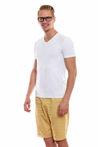 istock Studio shot of happy young handsome man smiling and standing while wearing eyeglasses 670255068