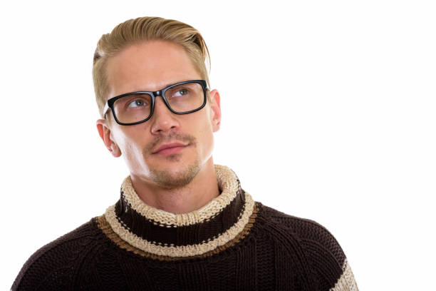 Young handsome man thinking and looking up while wearing eyeglasses horizontal shot