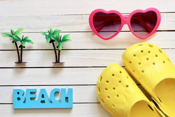 istock Sunglasses on the deck and Sandal 670258620
