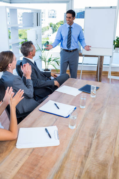 istock Business people applauding during a meeting 670262560