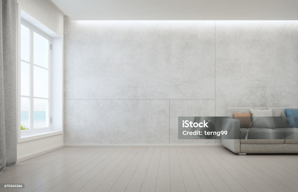 Sea view living room with wooden floor and concrete wall background in modern beach house, White interior of vacation home 3D rendering of interior with sofa Living Room Stock Photo