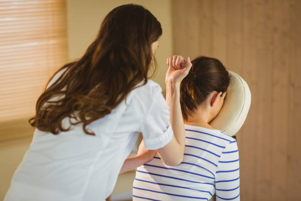 istock Young woman getting massage in chair 670266878