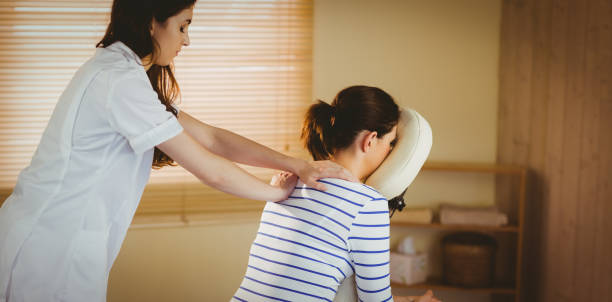 istock Young woman getting massage in chair 670267226
