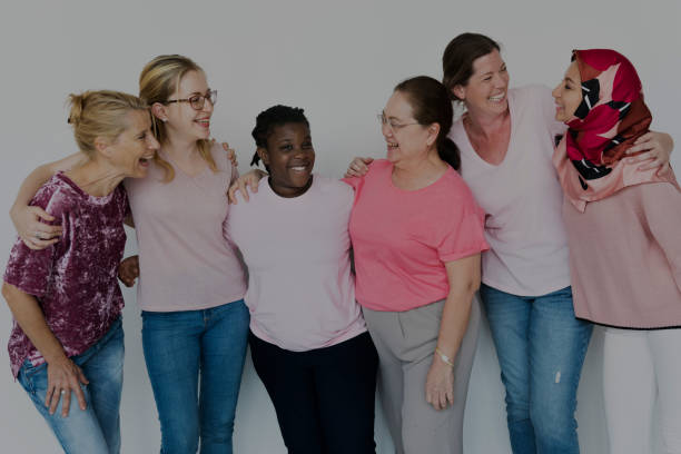 Group of Multiethnic Women Wear Pink Shirt Group of Multiethnic Women Wear Pink Shirt doing a favor stock pictures, royalty-free photos & images