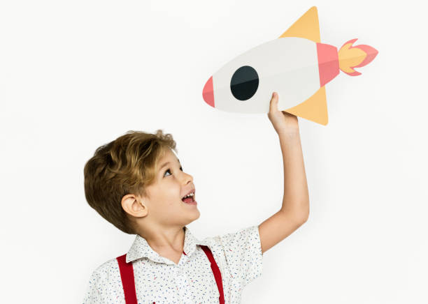 istock Little Boy Smiling Happiness Paper Craft Arts Rocket Studio Portrait 670271074