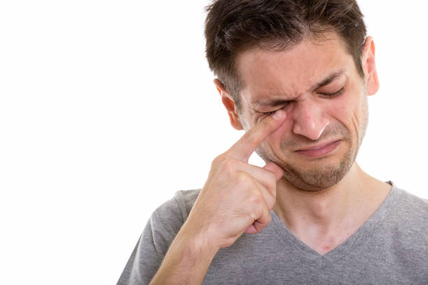 Close up of sad young man crying horizontal shot