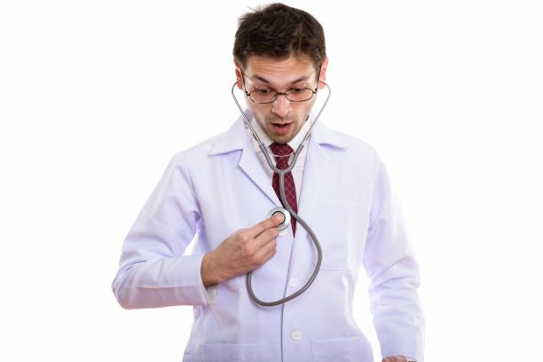istock Studio shot of young man doctor using stethoscope on himself while looking shocked 670273558