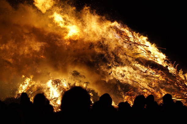 istock Silhouettes of people in front of easter fire 670277746