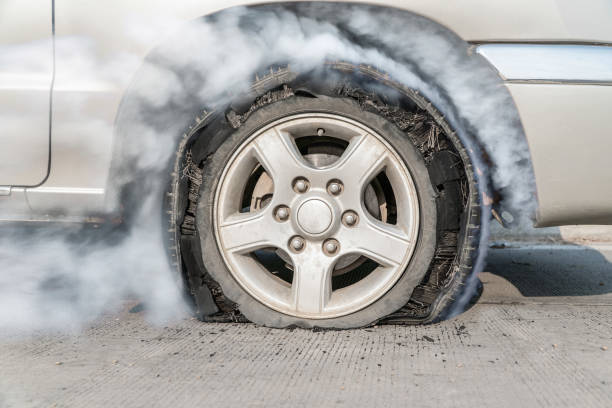 burst tire on the road burst tire on the road flat tire stock pictures, royalty-free photos & images