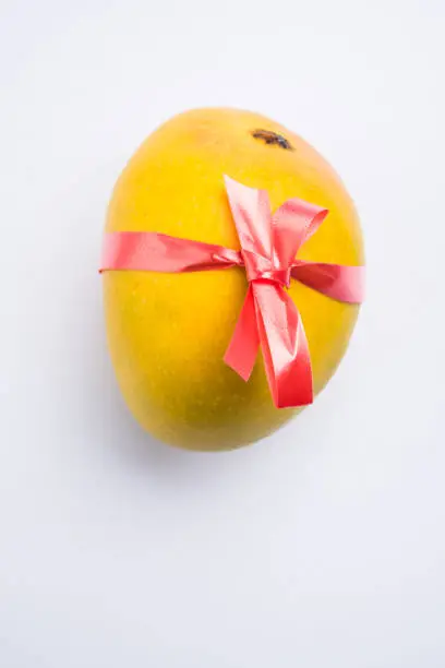 Photo of Indian sweet - traditional mango burfi or cake or bar made up of authentic alphonso or hapus mangos from konkan, india