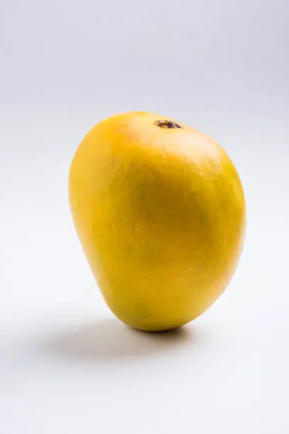 Photo of Indian sweet - traditional mango burfi or cake or bar made up of authentic alphonso or hapus mangos from konkan, india