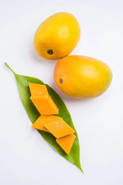 Photo of Indian sweet - traditional mango burfi or cake or bar made up of authentic alphonso or hapus mangos from konkan, india