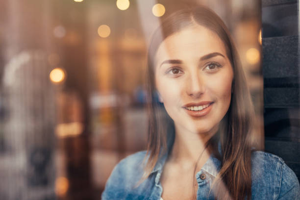 istock Beautiful woman at the window 670313076