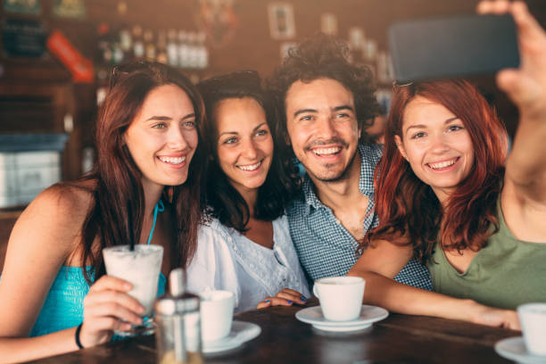 istock Friends taking a selfie at the cafe 670313082