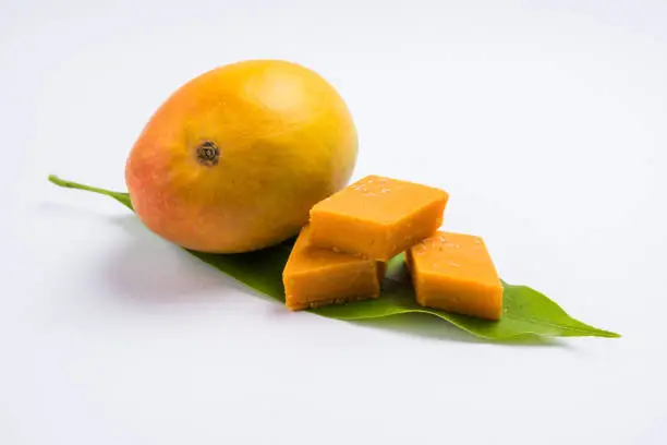 Photo of Indian sweet - traditional mango burfi or cake or bar made up of authentic alphonso or hapus mangos from konkan, india