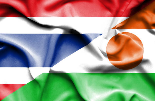 istock Waving flag of Niger and Thailand 670313226