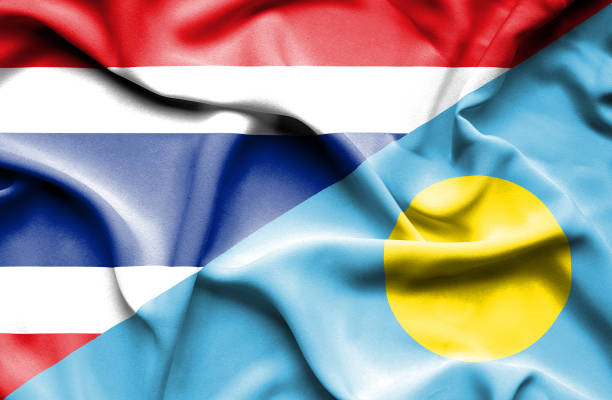istock Waving flag of Palau and Thailand 670313252