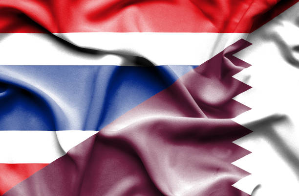 istock Waving flag of Qatar and Thailand 670313270