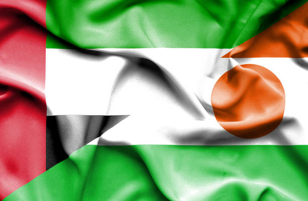 istock Waving flag of Niger and United Arab Emirates 670316368