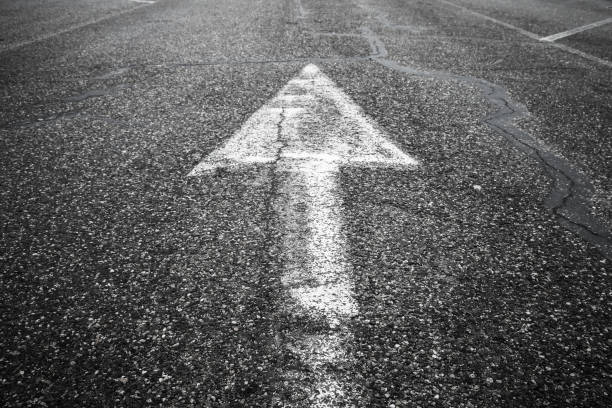 istock White arrow goes up over highway asphalt 670330330