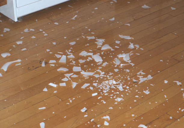 istock Broken glass pieces on the floor 670332682