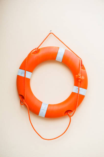 istock Life buoy hanging on the wall ready to help drowning people. 670333020