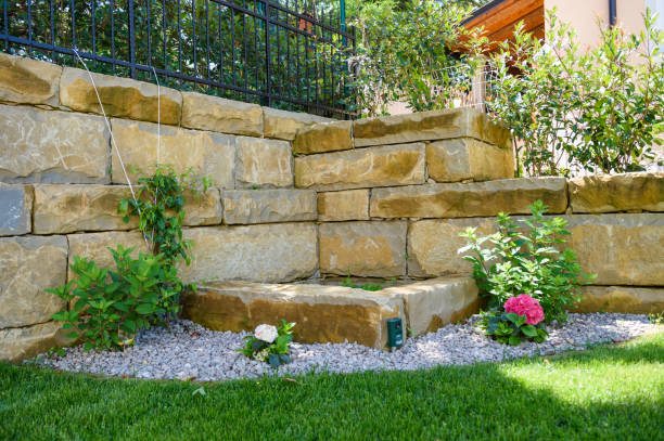 istock Stone fence with small pond 670333900