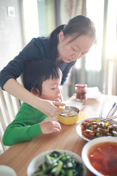 istock Happy Asian family enjoying lunc 670336896