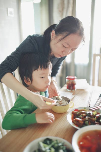 istock Happy Asian family enjoying lunc 670337104