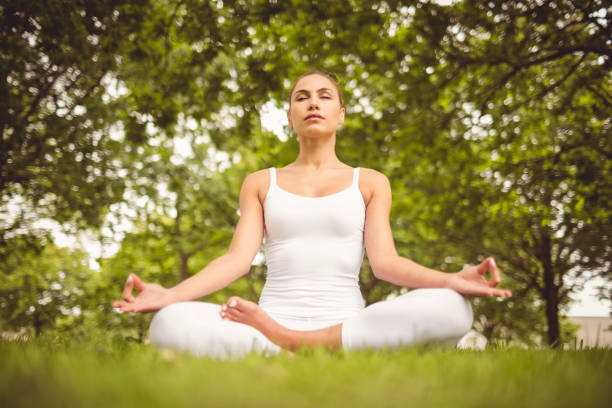 istock Low angle view of woman with eyes closed 670337654