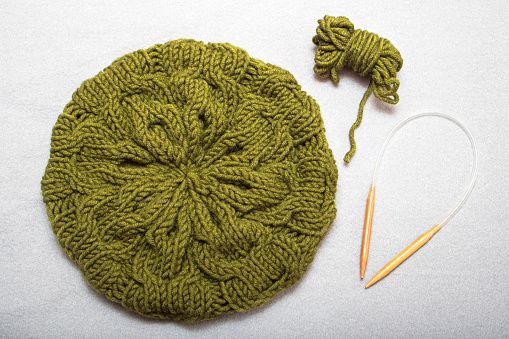 Olive-Green warm woolen winter beret, patterned bundles on circular knitting needles