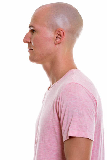 istock Profile view of young handsome bald man 670353100