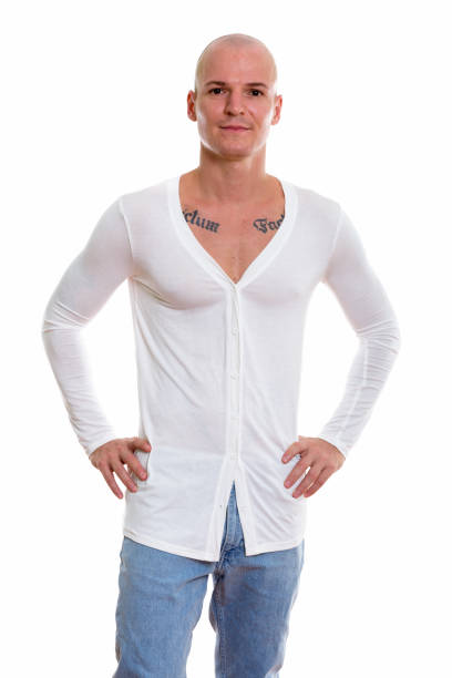 istock Studio shot of young handsome bald man standing while posing 670353884