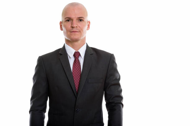 Studio shot of young handsome bald businessman horizontal shot