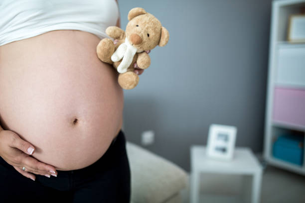 istock Woman Holding Teddy Bear 670365224