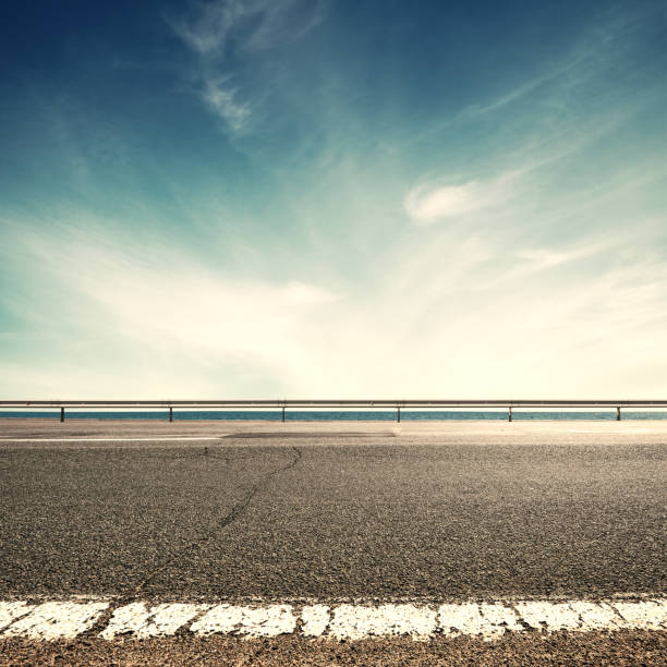 Asphalt road and sea coast line