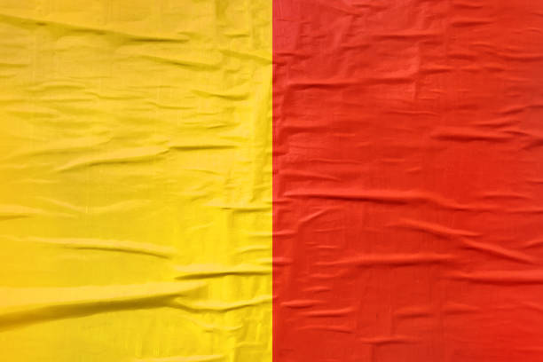 Yellow and red printed poster paper texture as background, useful for sport club team supporters placard or banner