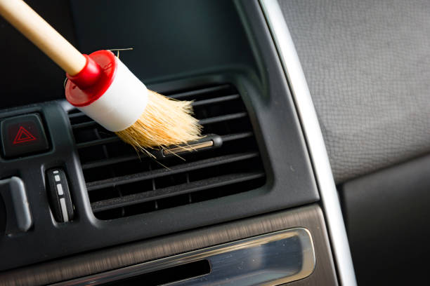 istock Brush cleaning off dust from the car 670369998