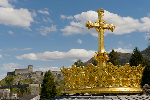 The  gilded crown ad cross in Lourdes, France