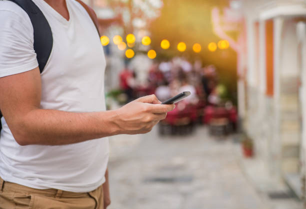 istock Man using mobile smart phone outdoor in summer. 670370714