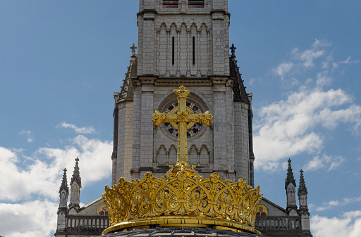 The  gilded crown ad cross in Lourdes, France