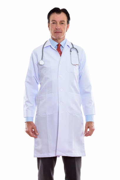 istock Studio shot of mature handsome man doctor standing 670371072