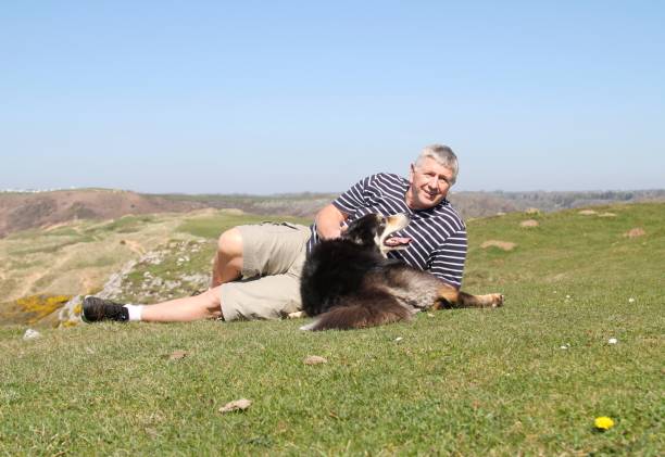 istock Senior man and dog outdoors 670374764