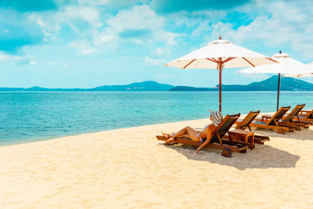 istock Woman in beach chair 670374916