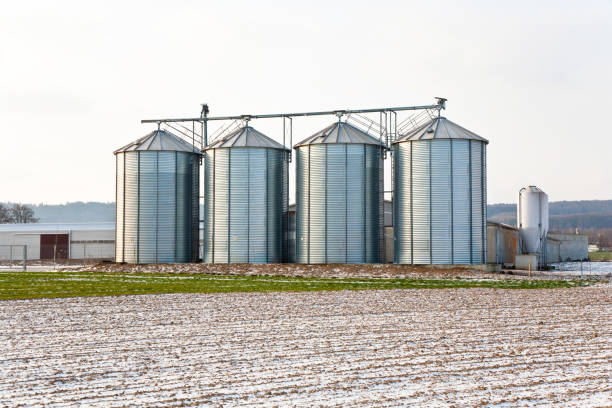 istock acres with snow in winter with silo in beautiful light and structure 670375044