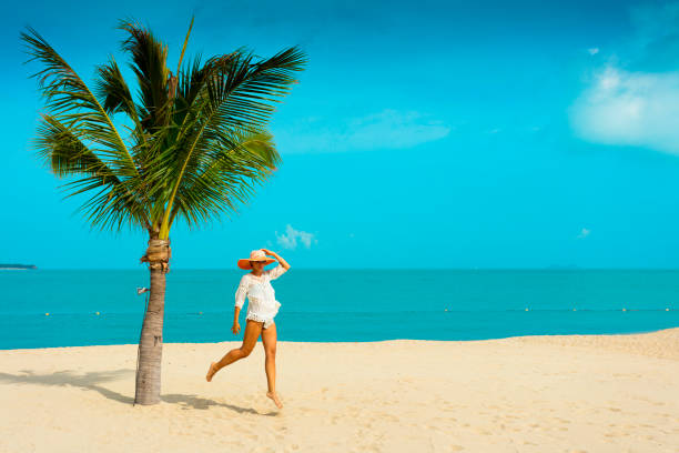istock Woman at tropical beach 670377266