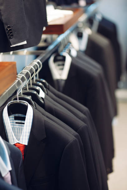 istock Hanger with men's suits and shirts 670378614