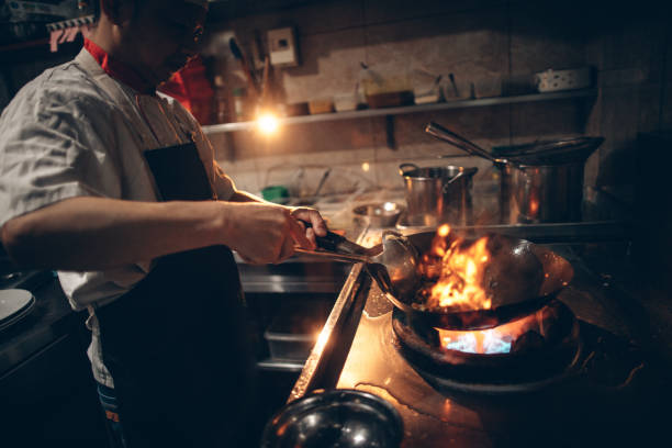 istock Chef preparing food in Chinese restaurant 670379288