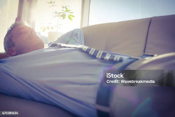 Businessman Relaxing On A Couch Stock Photo - Download Image Now - 30-39 Years, 35-39 Years, Adult