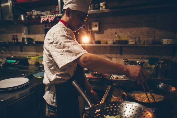 istock Chef preparing food in Chinese restaurant 670381918